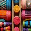 Selection of colorful artisanal crafting materials like fabrics and beads